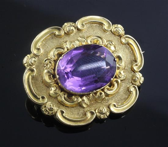 An early Victorian gold and amethyst set mourning brooch, 30mm.